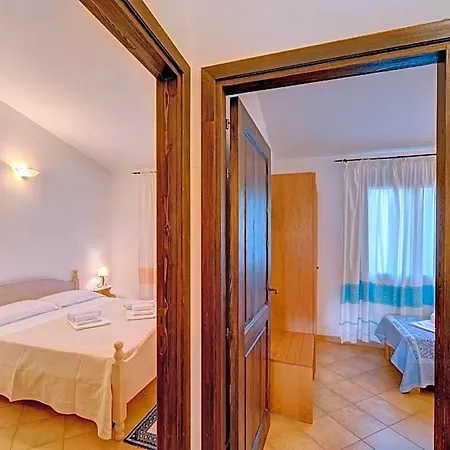 Апартаменты The Fantastic Residenza Badus 2 Bedroom Sleeps 6 Child Бадеси